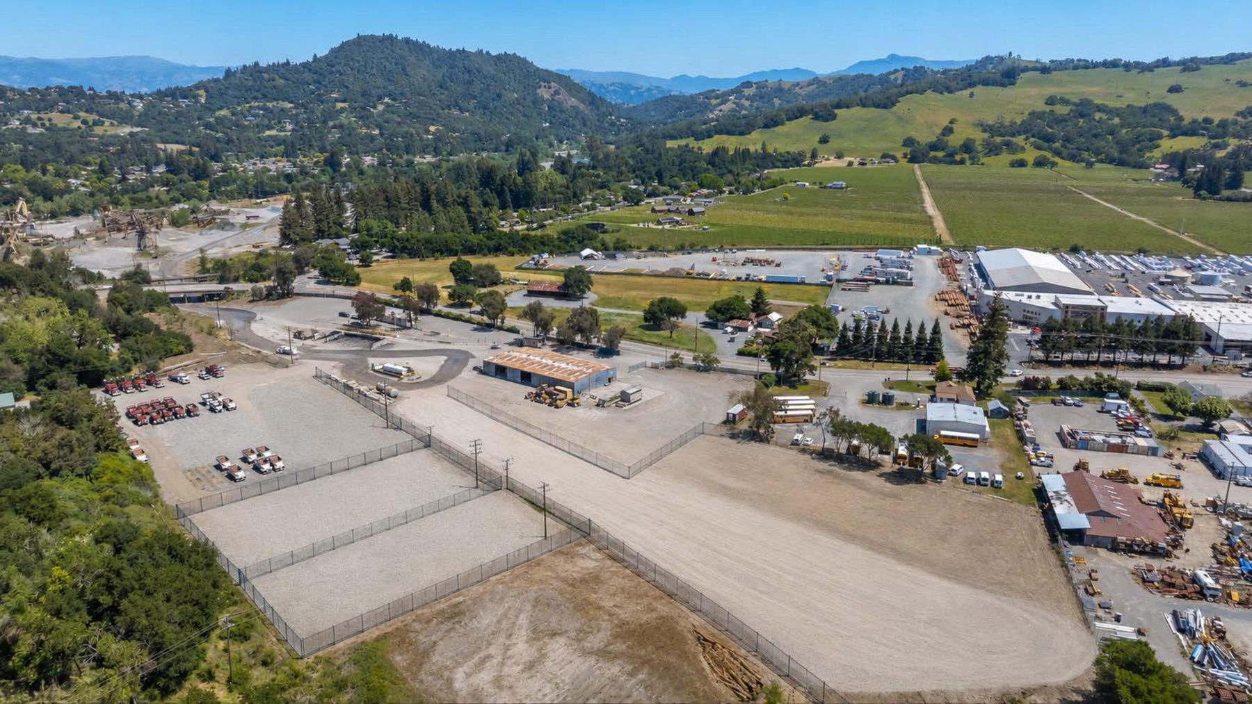 Aerial view of the yard at 13611 Healdsburg Avenue, with Sonoma County vineyards and hills in the background